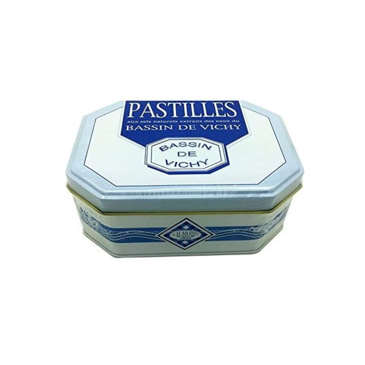 Hexagonal tin container for bassin de Vichy pastilles on a white background
